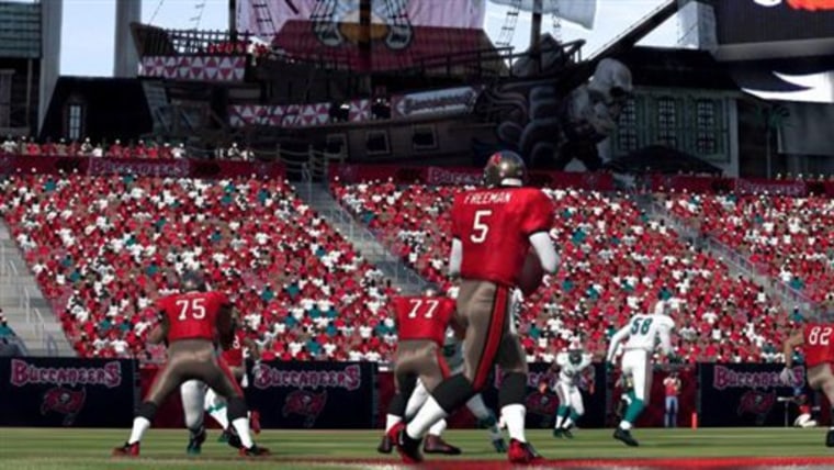 In this screen grab photo from EA Sports, virtual Tampa Bay Bucs quarterback Josh Freeman drops back to look for an open receiver in a scene from the video game "Madden NFL 12."